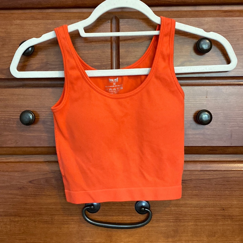 Coral workout top with ribbed detail and built in bra